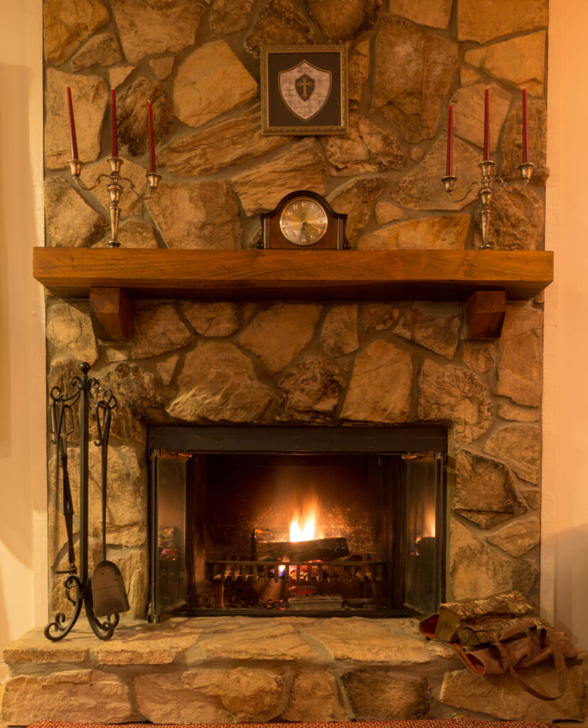 Wood fireplace aglow on a cold winter night.